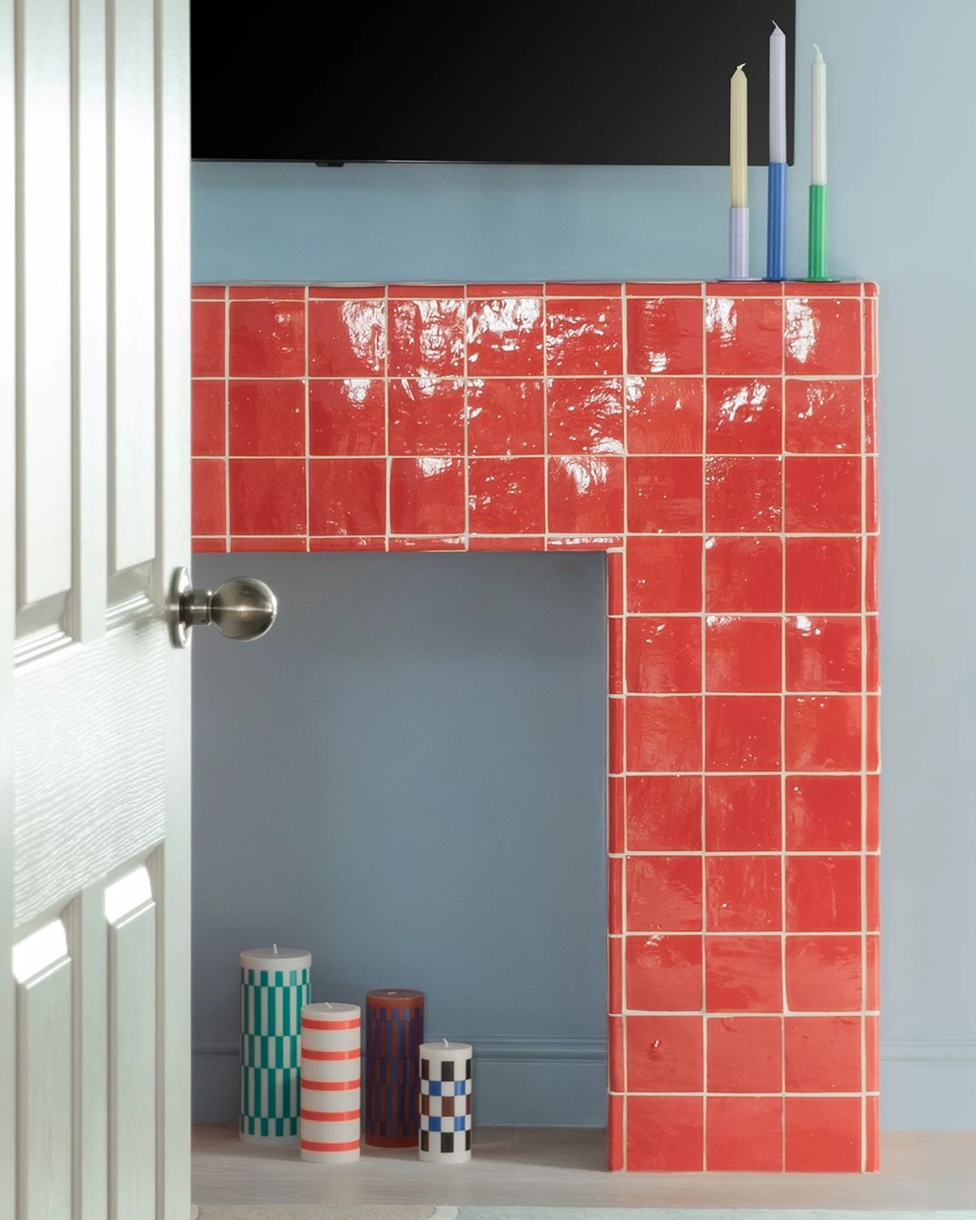 Decorative fireplace with red zellige tiles
